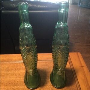 Pair of vintage green fish bottles